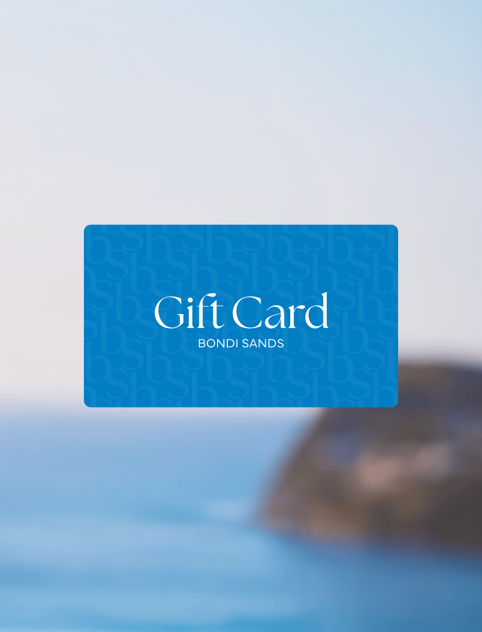 Blue gift card with 'Gift Card Bondi Sands' text on a blurred beach background