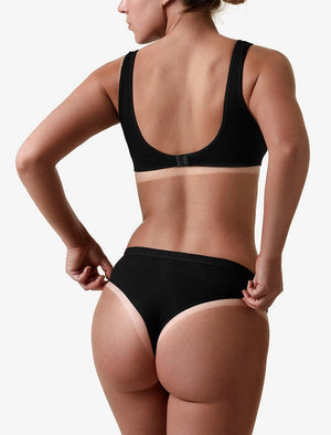 Back image of model showing her before and after tan