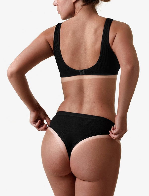 Back image of model showing her before and after tan