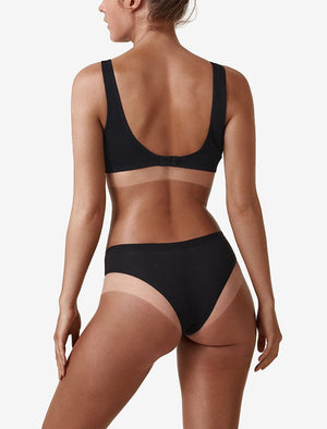 Back image of model showing spray tan skin contrast