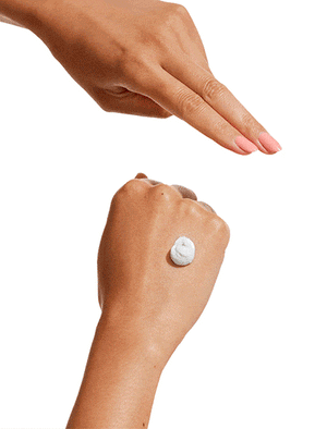 Swatch of clay mask on the back of hand