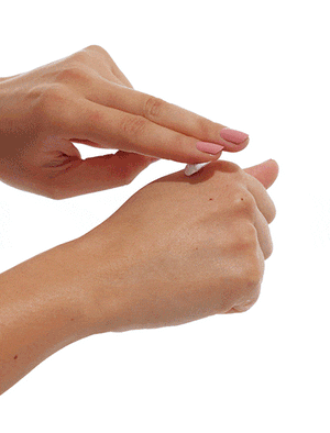 swatch of face glaze hydrating face mask on the back of hand