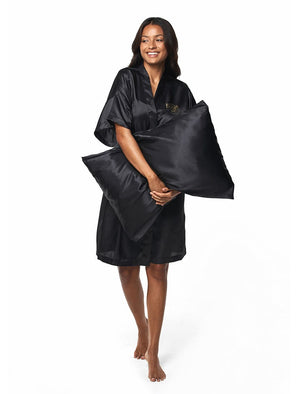 Self Tanning Pillow Protector on a pillow being held by model