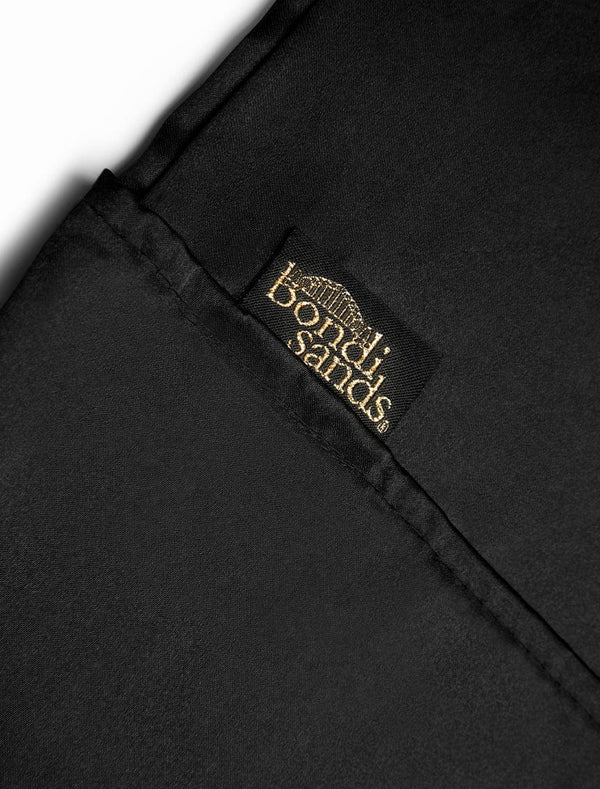 Self Tanning Pillow Protector logo and texture close up